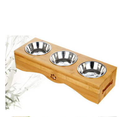Stainless steel bowls in a bamboo holder, side view