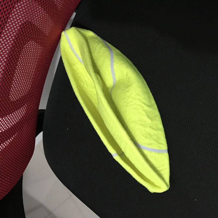 Deflated giant tennis ball before pumping up