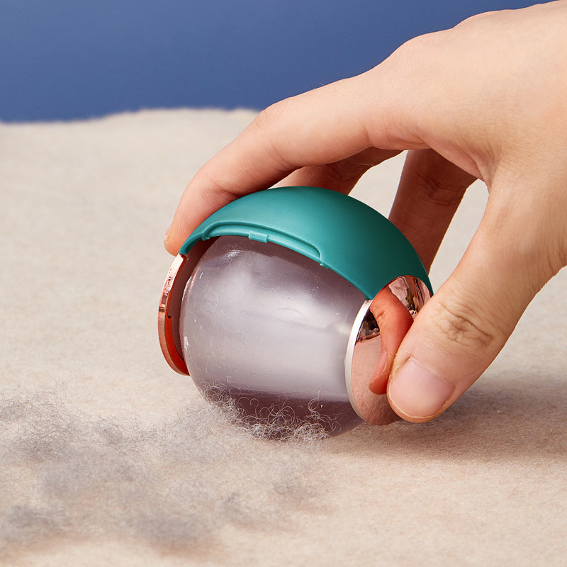 Reusable lint roller ball picking up hair