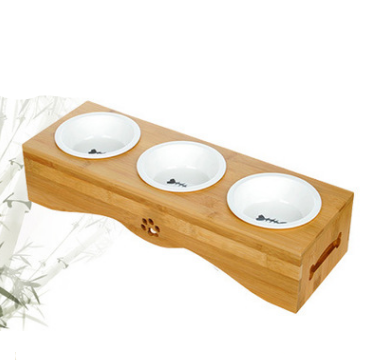 Ceramic bowls in a bamboo holder, side view