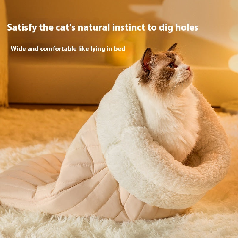Cat burrowing into the sleeping bag